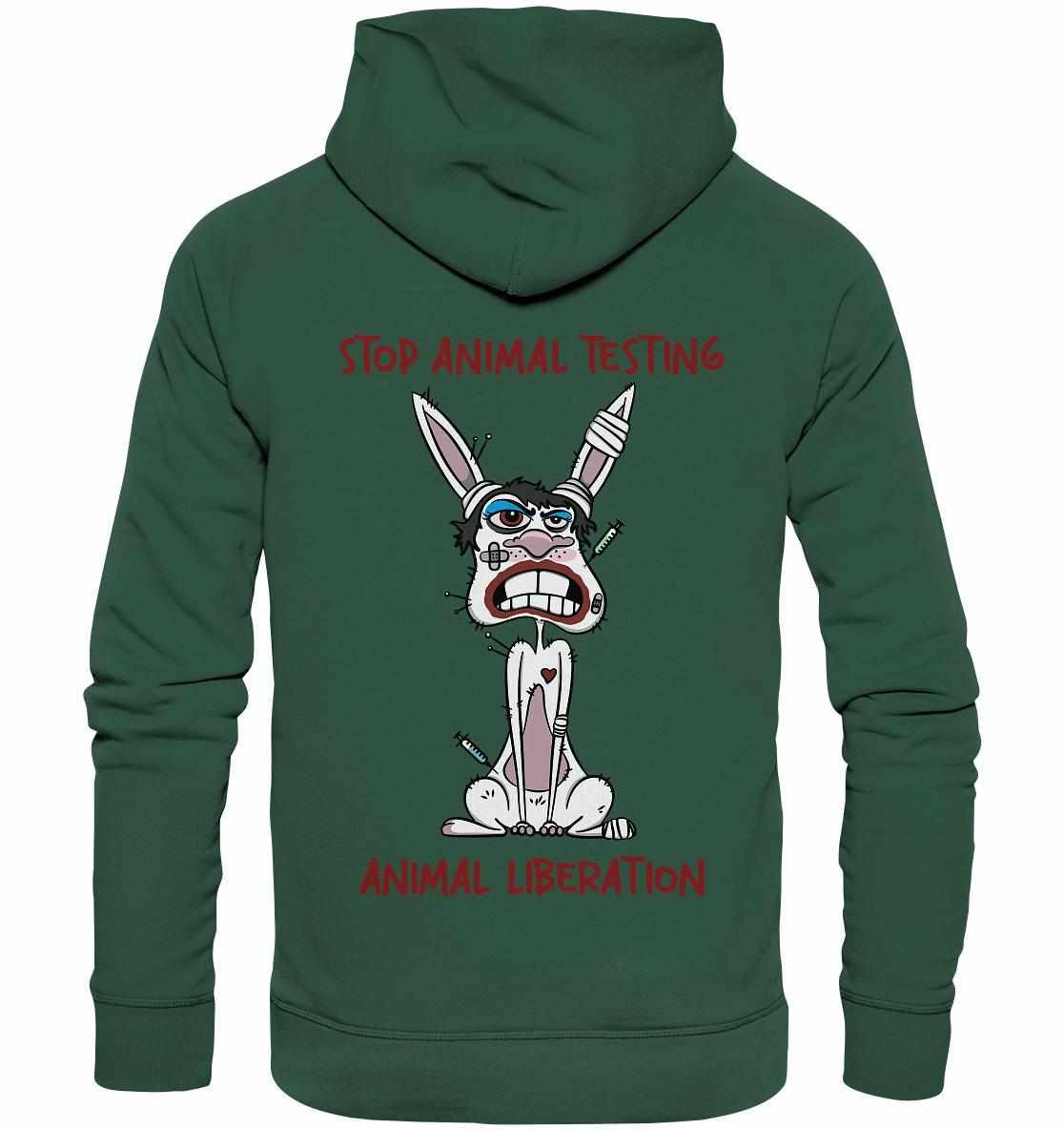 Vegan und Bio Hoodie: Weißer Hase mit Anti-Tierversuche-Motiv auf grünem Hoodie, symbolisiert Tierschutz. Nachhaltig aus Bio-Baumwolle, von RUDE REBEL.