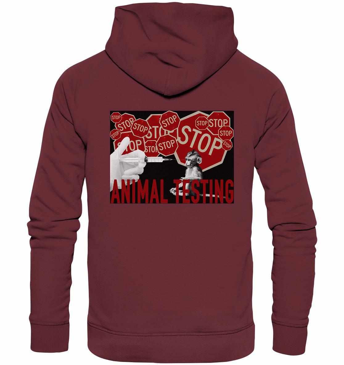 Person trägt Vegan und Bio Hoodie: STOP ANIMAL TESTING! mit Stoppschild-Design, das gegen Tierversuche protestiert. Hergestellt aus Bio-Baumwolle, umweltfreundlich und vegan.