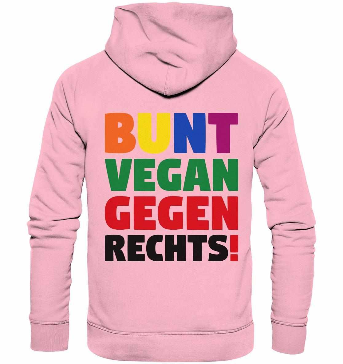 Vegan und Bio Hoodie: BUNT, VEGAN und GEGEN RECHTS! Pinker Hoodie mit mehrfarbigem Text, inspiriert von Toleranz und Nächstenliebe. Hergestellt aus Bio-Baumwolle und recyceltem Polyester.