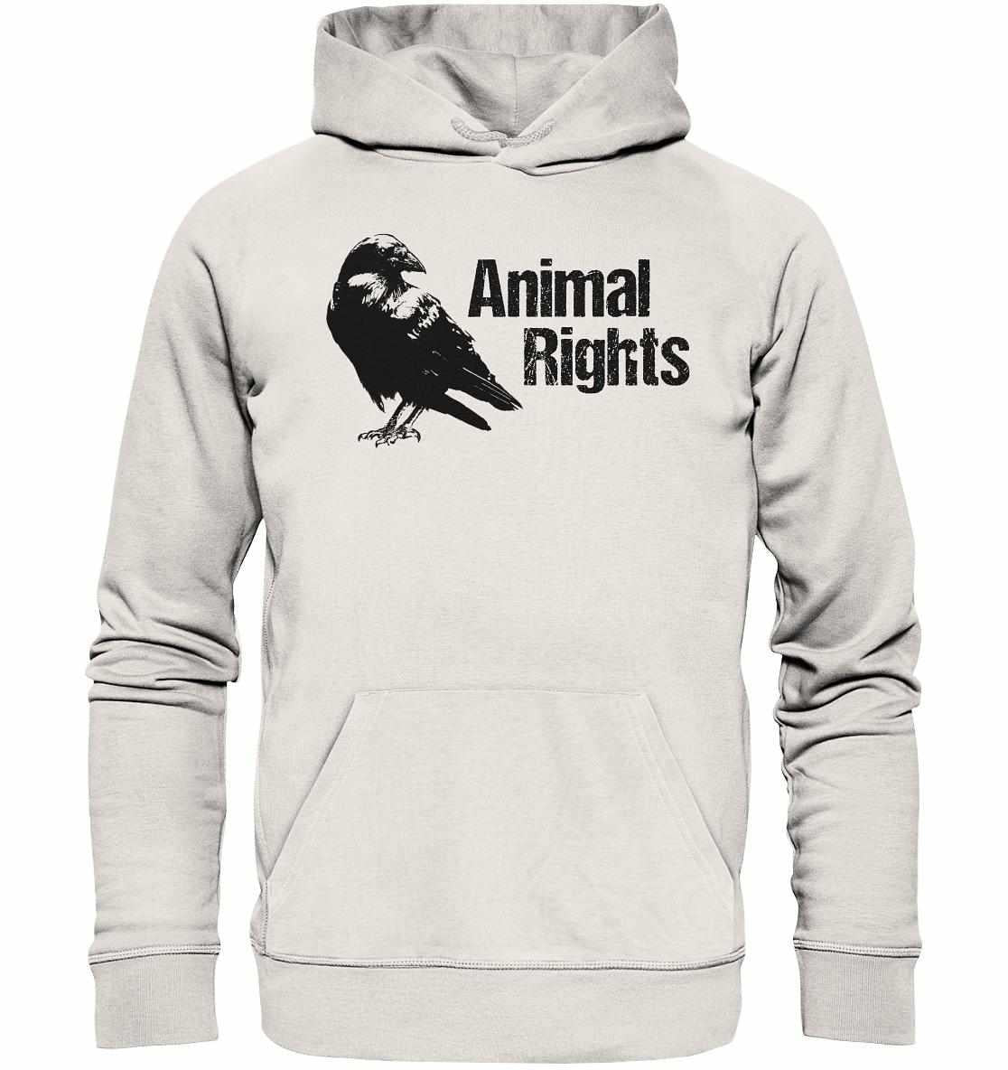 Vegan und Bio Hoodie: Raven - Animal Rights, zeigt einen schwarzen Vogel-Druck auf weißem Stoff, symbolisiert Freiheit und Tierschutz, aus nachhaltigen Materialien gefertigt.