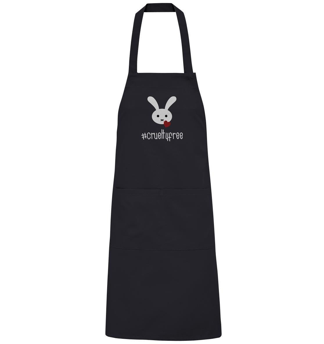Vegan und Bio Schürze: Crueltyfree Bunny BIG zeigt einen weißen Hasen mit rotem Herz, symbolisiert vegane Bewegung, hergestellt aus Bio-Baumwolle mit verstellbarem Ausschnitt und großen Vordertaschen.