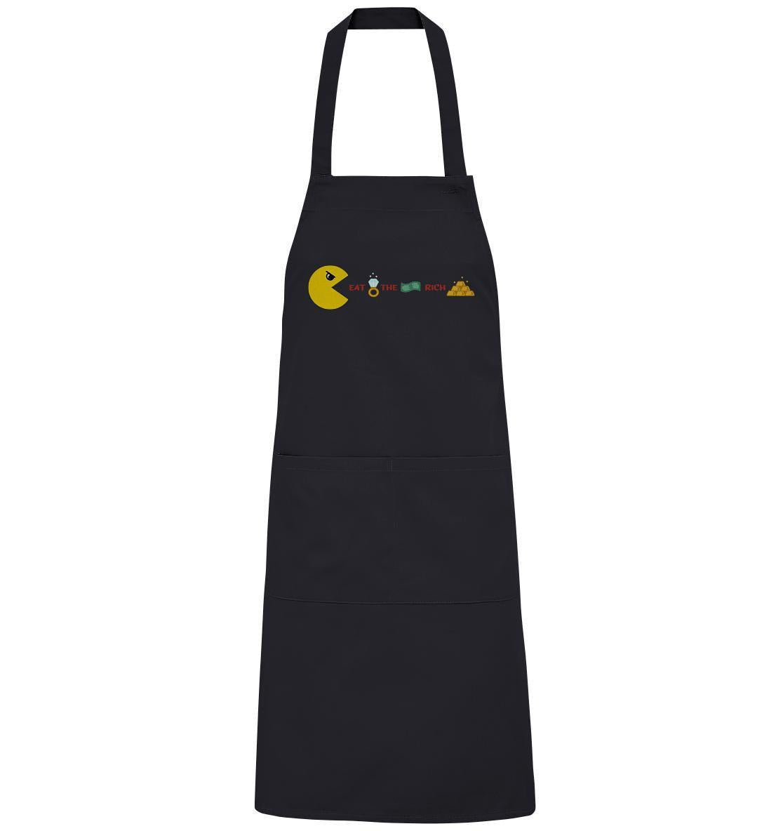 Vegan und Bio Schürze: PAC-MAN - Eat the rich, schwarze Schürze mit gelbem Pac-Man-Design, aus Bio-Baumwolle, verstellbar mit großen Vordertaschen.