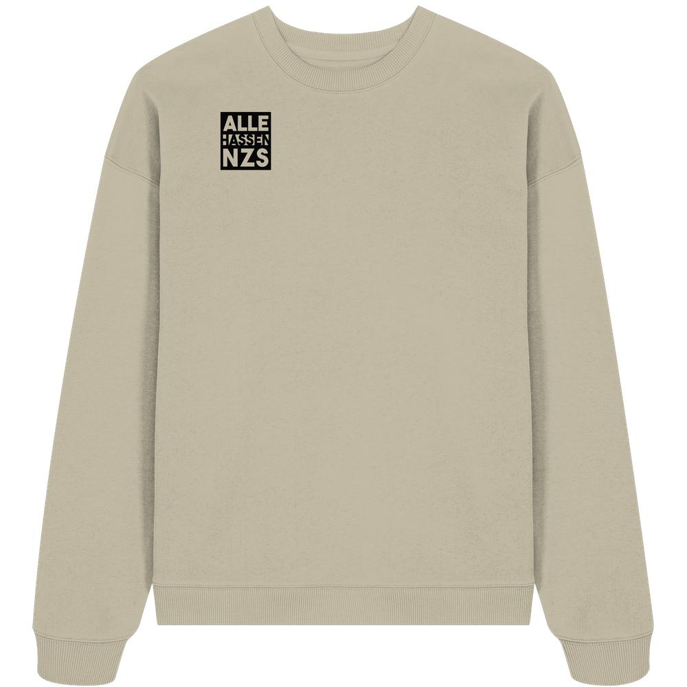 Vegan und Bio Oversized Sweatshirt: ALLE HASSEN NZS! in Beige mit schwarzem Grafikdruck auf der Brust, aus 100% Bio-Baumwolle, hergestellt von RUDE REBEL.