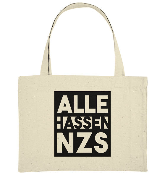 Natürliche Stofftasche aus recyceltem Material mit dem Grafikdesign „ALLE HASSEN NZS!“ in weißer Schrift auf schwarzem Hintergrund, ideal für veganen und nachhaltigen Lebensstil.