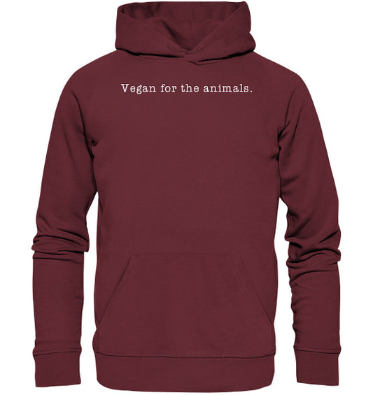Minimalism Design - Vegan for the animals. - Organic Basic Hoodie, getragen von einer Person, zeigt weiße Schrift auf rotem Stoff, mit Bio-Baumwolle und recyceltem Polyester.
