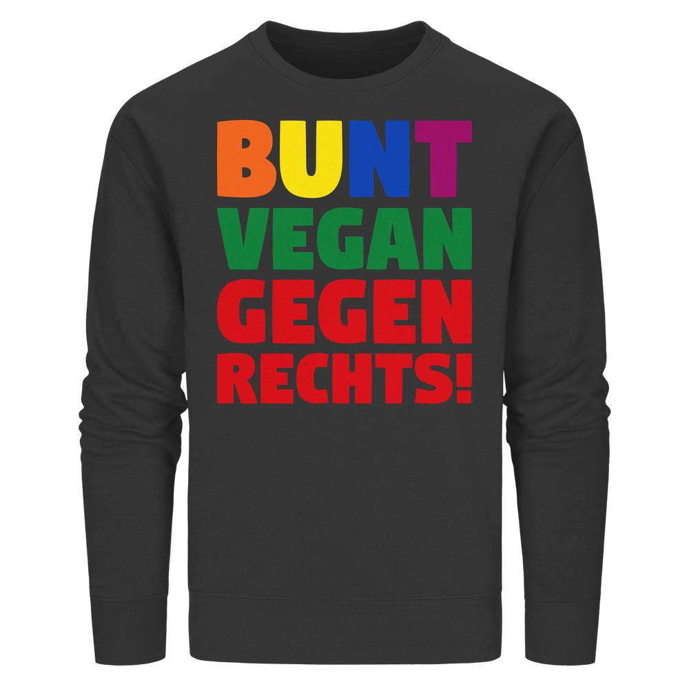 Schwarzes Unisex-Sweatshirt mit langem Ärmel, bedruckt mit buntem Slogan „BUNT, VEGAN und GEGEN RECHTS!“, aus Bio-Baumwolle und recyceltem Polyester, normale Passform.