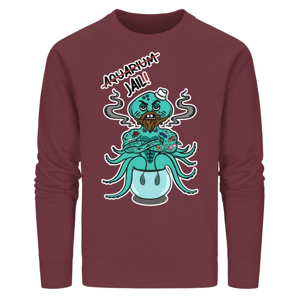 Vegan und Bio Unisex Sweatshirt mit cartoonhaftem Oktopus-Design Animal Rights - Aquarium=Jail!. Muskulöser, tätowierter Oktopus im Fischglas, thematisiert Tierrechte.