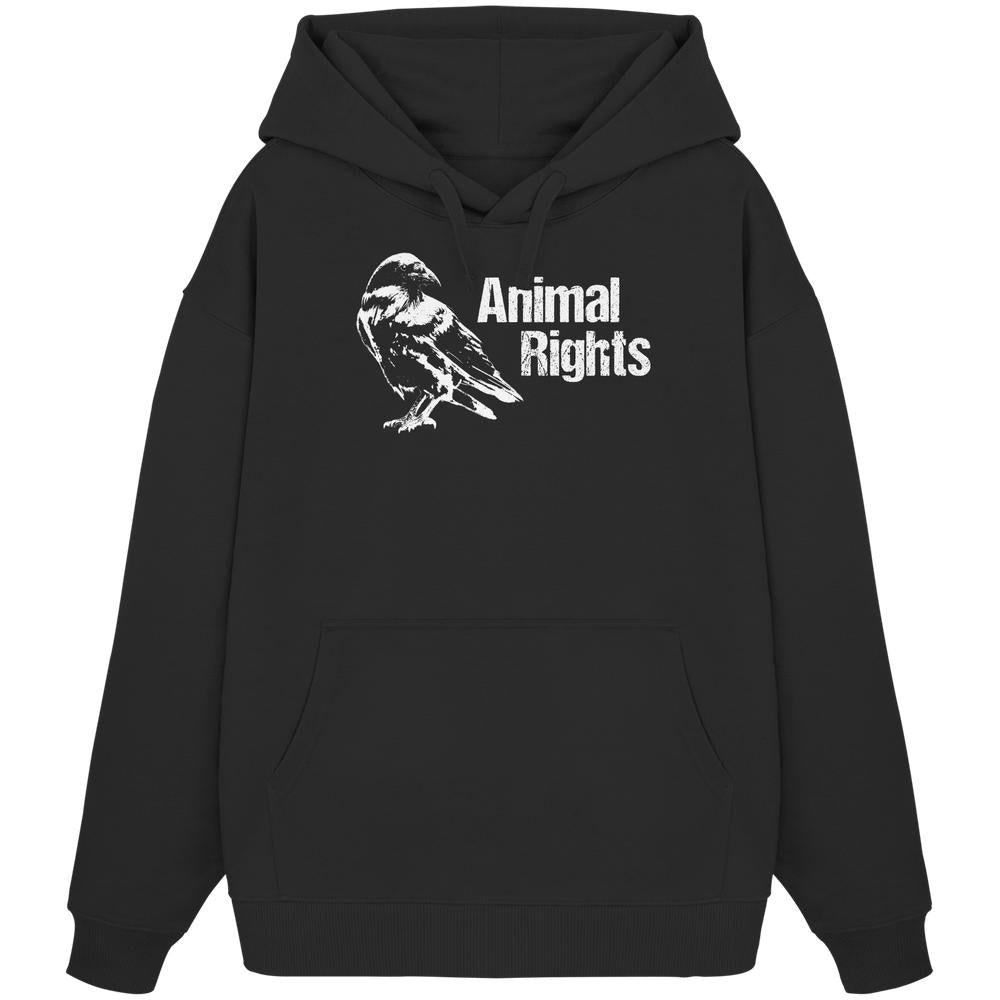 Vegan und Bio Oversized Hoodie: Raven - Animal Rights, zeigt eine weiße Krähenillustration und den Schriftzug „Animal Rights“ auf schwarzem Hoodie mit Kängurutasche und Kapuze.