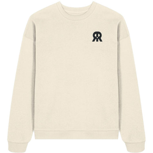 Vegan und Bio Oversized Sweatshirt bestickt: RUDE REBEL Skull, ein helles, cremefarbenes Sweatshirt mit einem schwarzen Logo auf der Brust, aus 100% Bio-Baumwolle.