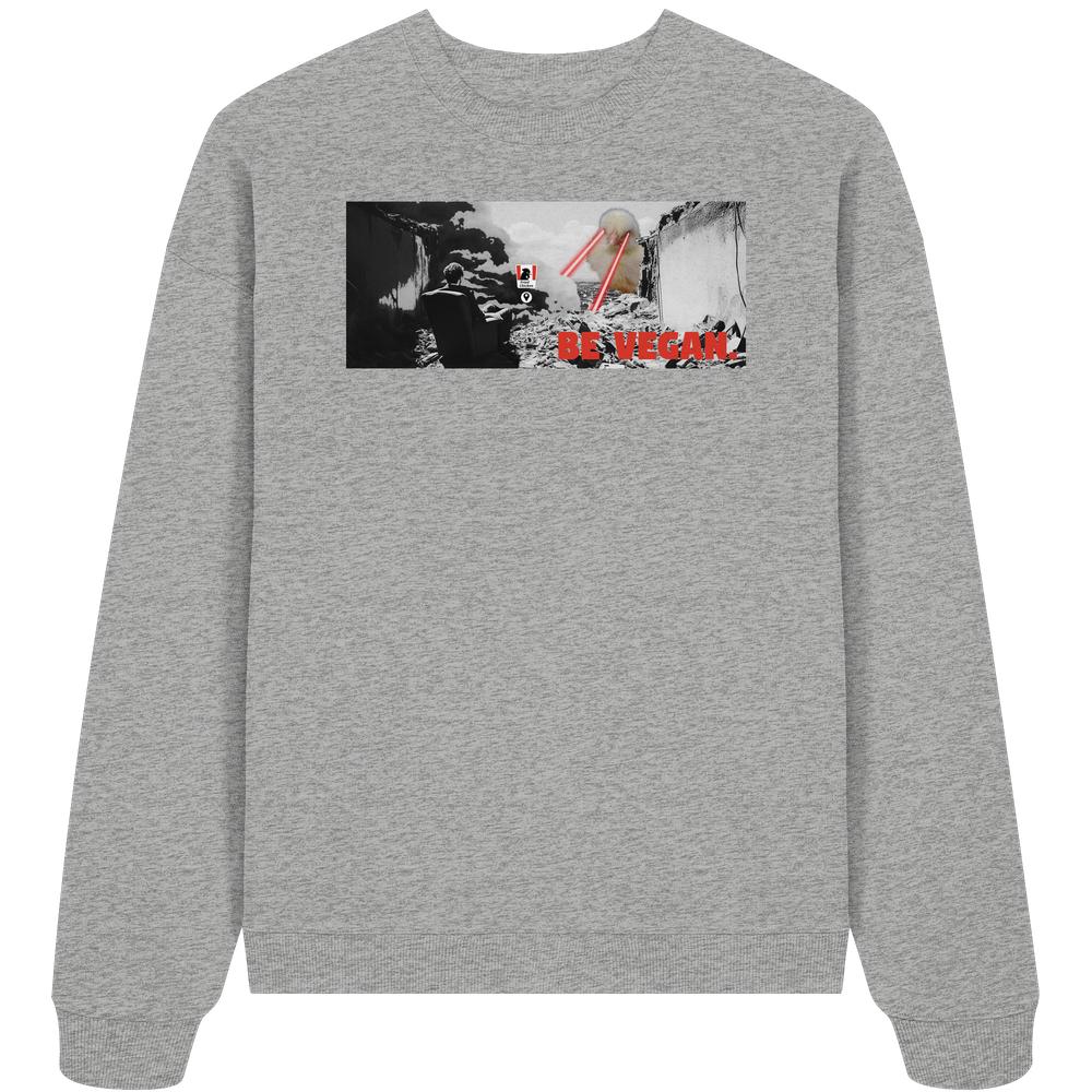 Vegan und Bio Oversized Sweatshirt: BE VEGAN. zeigt postapokalyptische Grafik mit sitzender Figur und Laserstrahlen, betont vegane Botschaft, 100% Bio-Baumwolle, rebellisches Design von RUDE REBEL.