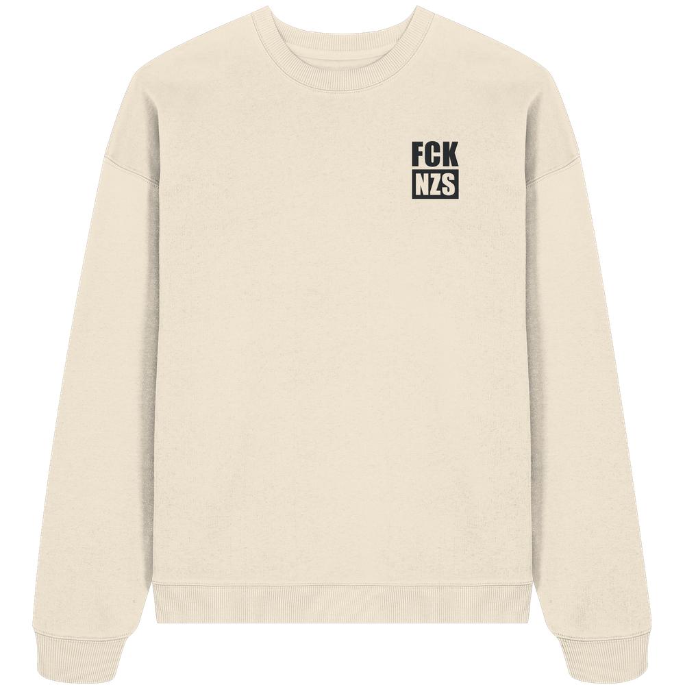 Vegan und Bio Oversized Sweatshirt bestickt: FCK NZS, hellbeiges Crewneck mit schwarzem Schriftzug auf der Brust, aus 100% Bio-Baumwolle, rebellisches Design von RUDE REBEL.