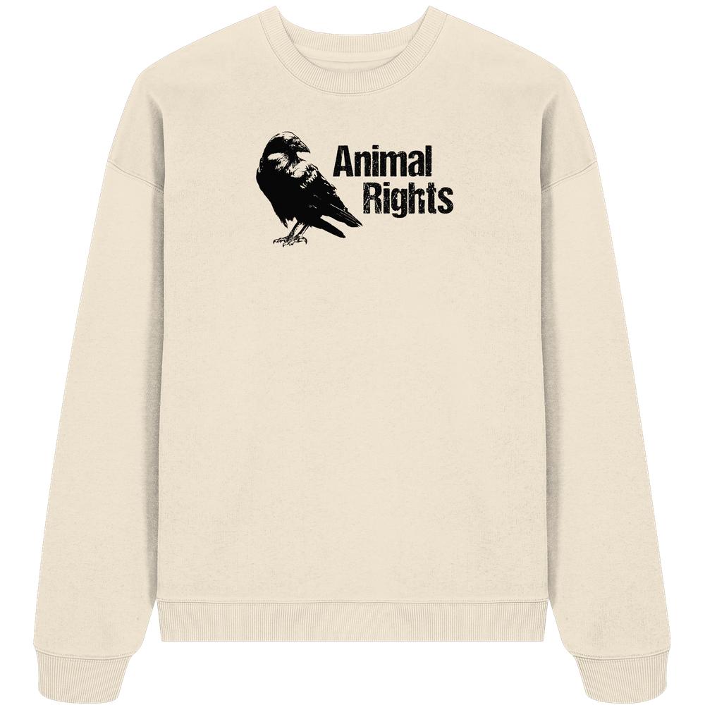 Vegan und Bio Oversized Sweatshirt: Raven - Animal Rights mit Krähen-Silhouette und Text auf cremefarbenem Stoff, betont Tierrechte und Nachhaltigkeit im rebellischen Design.