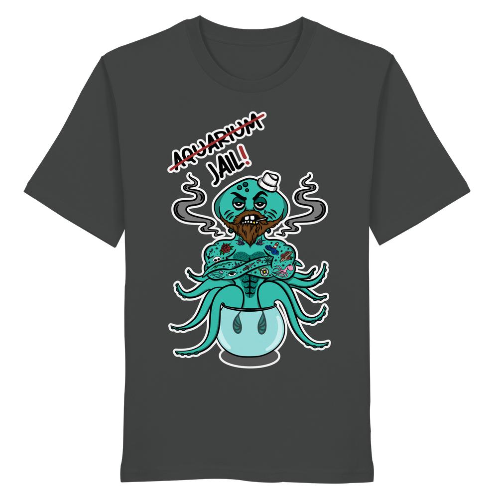 Vegan und Bio Unisex Shirt zeigt einen grimmigen Oktopus mit Kapitänsmütze und Tattoos, im Fischglas sitzend, mit Aquarium=Jail!-Botschaft. 100% Bio-Baumwolle.