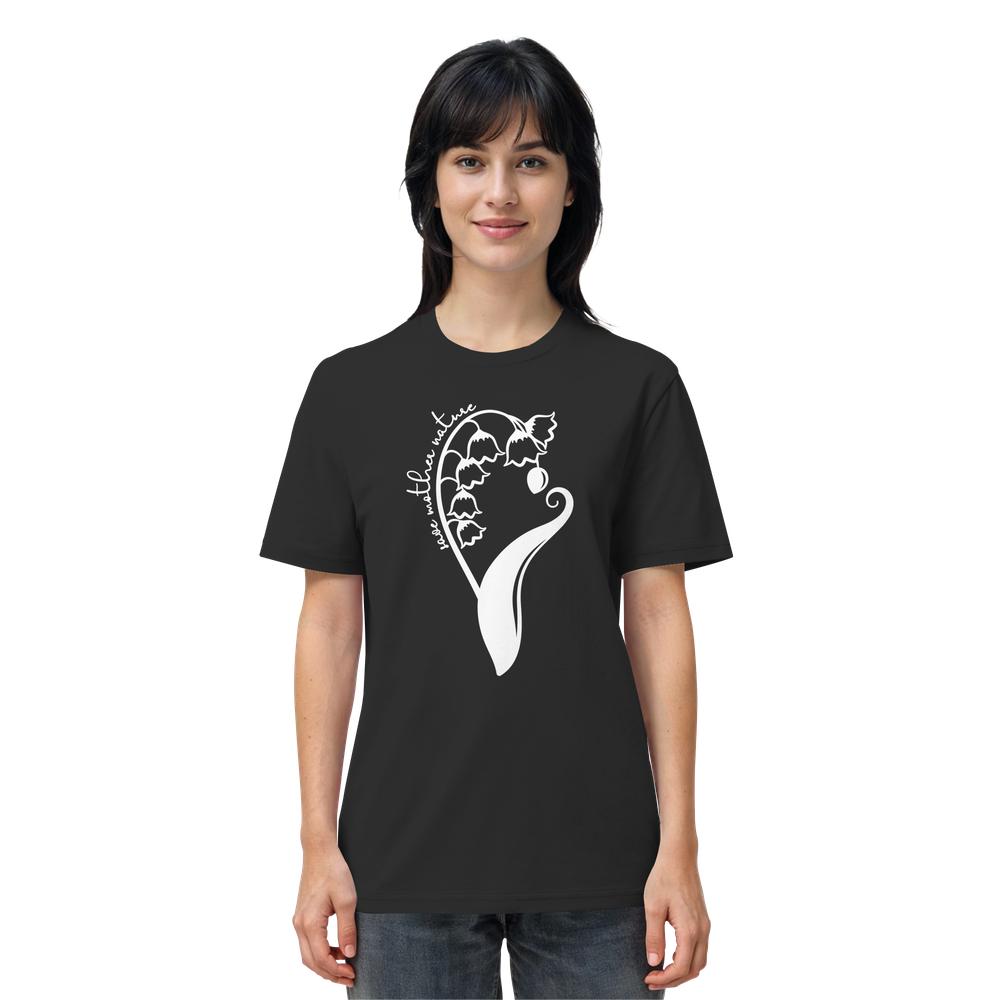 Person trägt das Vegan und Bio Unisex Shirt: Save Mother Nature with Flower Power mit einem stilisierten weißen Blumenmotiv und dem Schriftzug „see nature“ auf schwarzem Bio-Baumwollstoff.