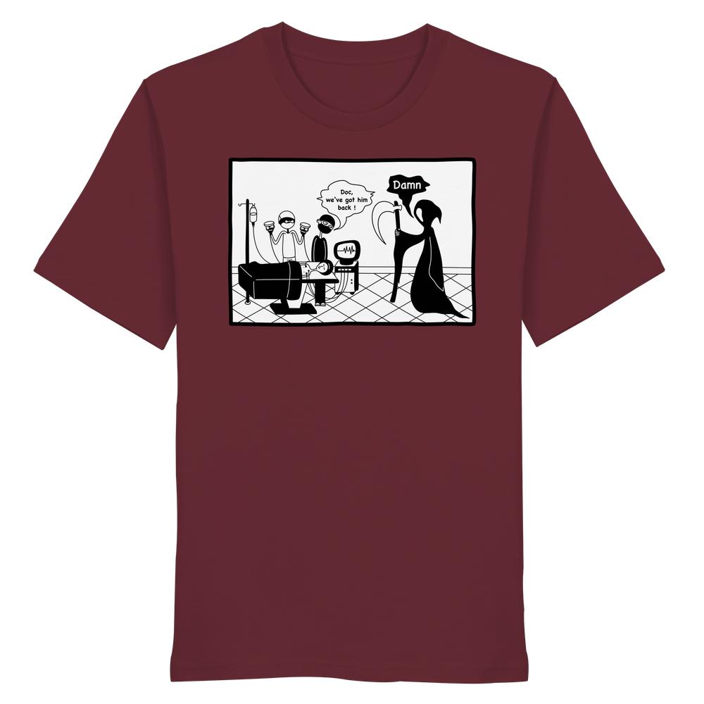 Vegan und Bio Unisex Shirt: Comicstripe - The Reaper, zeigt Grim Reaper verblüfft von moderner Medizin, auf maroonem T-Shirt aus 100% Bio-Baumwolle.
