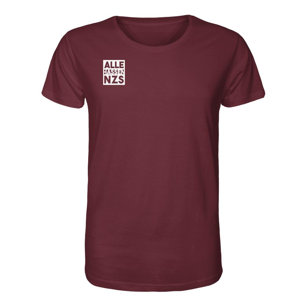 Vegan und Bio Unisex Shirt: ALLE HASSEN NZS! mit kleinem weißen Quadrat und Slogan auf der linken Brust, aus 100 % Bio-Baumwolle.