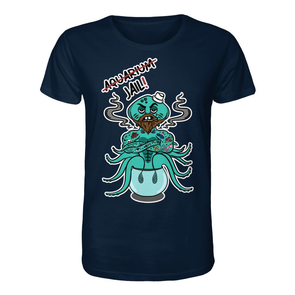 Vegan und Bio Unisex Shirt: Animal Rights - Aquarium=Jail! zeigt einen tätowierten, grummeligen Oktopus mit Pfeifen, der aus einem Aquarium ausbricht, symbolisiert Tierrechtsbotschaft.