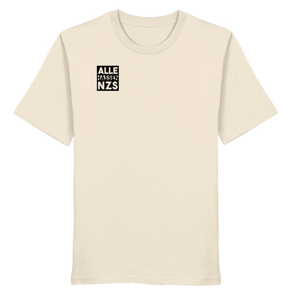 Vegan und Bio Unisex Shirt: ALLE HASSEN NZS! Ein schlichtes, hellbeiges T-Shirt mit kleinem schwarzen Quadrat und weißem Text auf der Brust, aus 100 % Biobaumwolle.