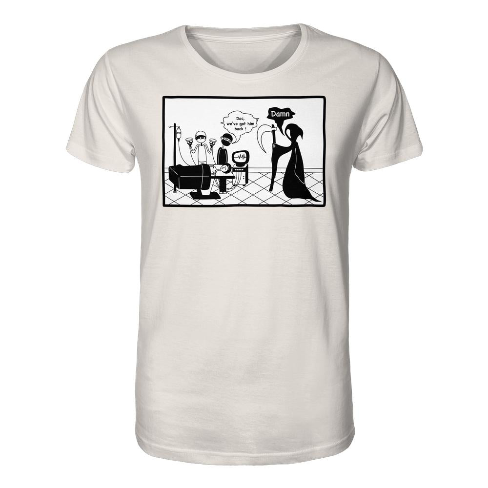 Unisex-Shirt aus Bio-Baumwolle mit Comic-Panel: Chirurgen retten Patient, Grim Reaper überrascht. Passform: normal, Material: 100% Baumwolle. Von RUDE REBEL, thematisiert moderne Medizin.