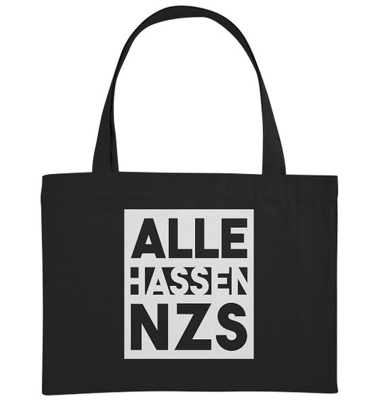 Schwarze, extragroße Stofftasche aus recycelten Materialien mit dem Slogan „ALLE HASSEN NZS“ in weißen Blockbuchstaben, repräsentiert vegane und nachhaltige Botschaft von RUDE REBEL.