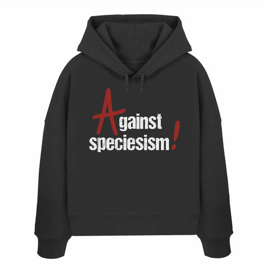 Vegan und Bio Crop Hoodie: Against speciesism! Schwarzer Hoodie mit weißem Text, doppellagiger Kapuze und abfallenden Schultern, aus 100% Bio-Baumwolle, rebellisches Design von RUDE REBEL.