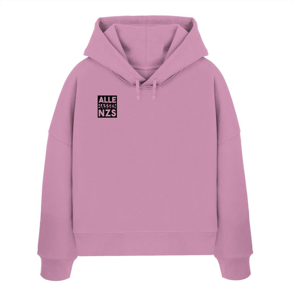Vegan und Bio Crop Hoodie: ALLE HASSEN NZS! Pastellrosa Hoodie mit Kapuze, schwarzem ALLE HASSEN NZS Print, aus 100% Bio-Baumwolle, rebellisches Design von RUDE REBEL.