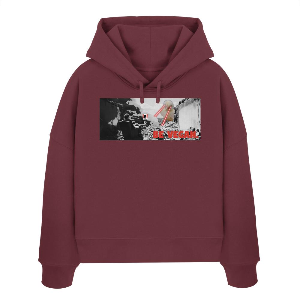 Marooner Hoodie mit Grafik eines zerstörten Stadtbilds und eines Tieres mit Laseraugen, beschriftet mit BE VEGAN. Hergestellt aus 100% Bio-Baumwolle.