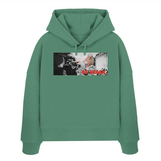 Vegan und Bio Crop Hoodie: BE VEGAN, mint-grün, mit Grafik eines sitzenden Menschen und einer Kuh, die rote Laserstrahlen schießt, darunter BE VEGAN.