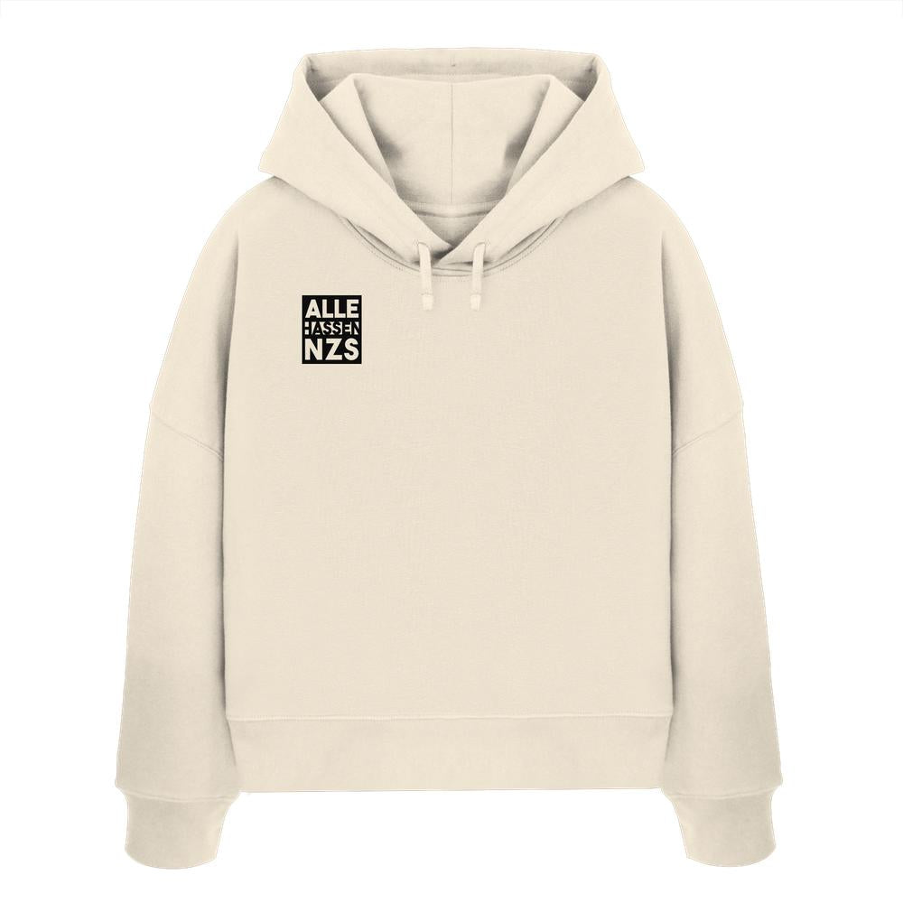 Vegan und Bio Crop Hoodie: ALLE HASSEN NZS! in Beige mit schwarzem Print auf der Brust, aus 100% Bio-Baumwolle, designed von RUDE REBEL.