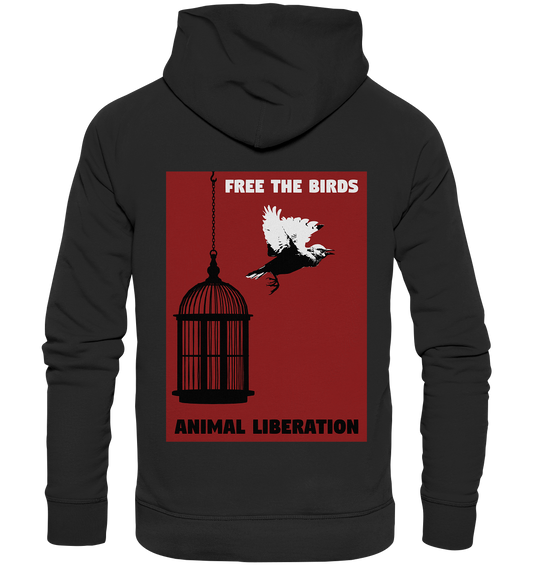 Vegan, Organic & Recycled Hoodie: Free the birds - Animal Liberation (bedruckt mit schwarzem Vogelkäfig auf der einen Seite und einem fliegenden Vogel auf der anderen Seite, der sich vom Käfig abgestoßen hat, darüber in weißer Druckschrift „Free the birds“ und unten in schwarzer Druckschrift „Animal Liberation“ auf rotem Hintergrund) Farbe: schwarz